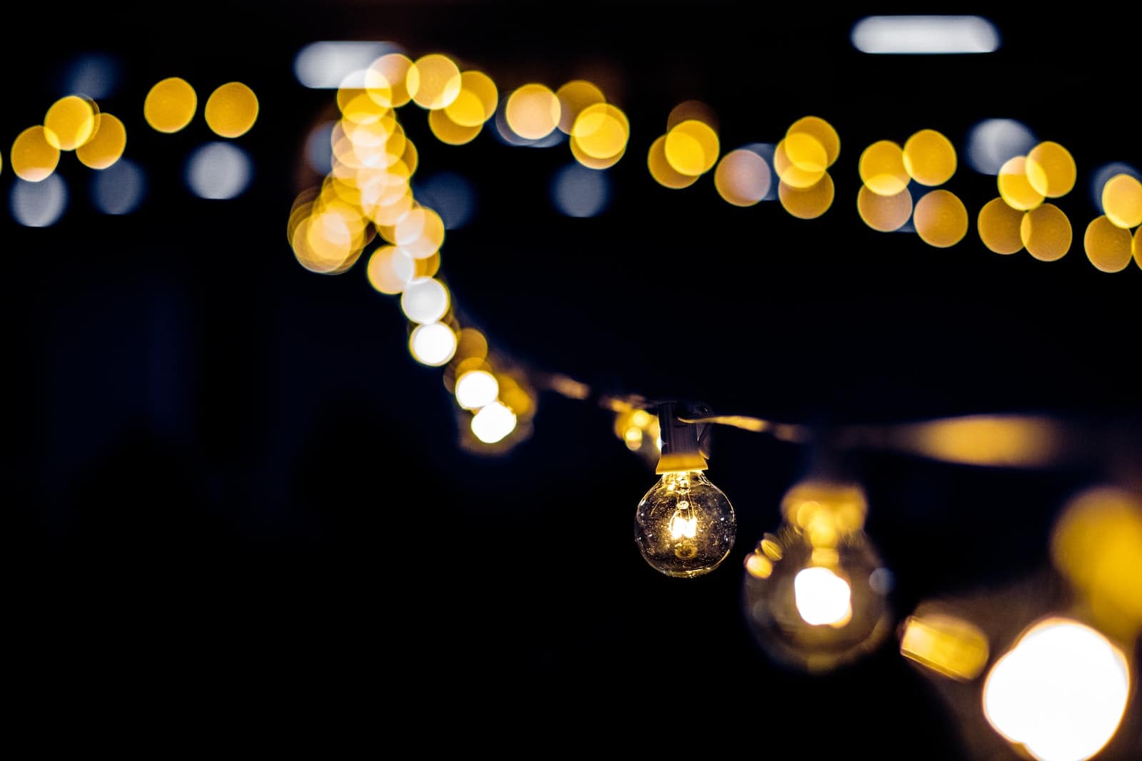 How to Hang String Lights in Your Backyard Without Trees (8 Ways