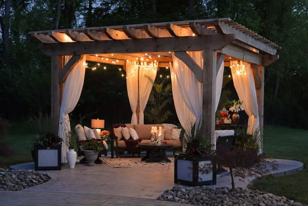 photo of gazebo with curtain and string lights, patio