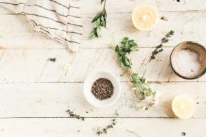 green herb beside ceramic bowl