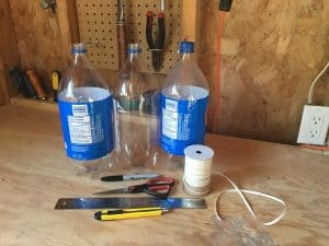 Materials needed for a bottle tower garden.